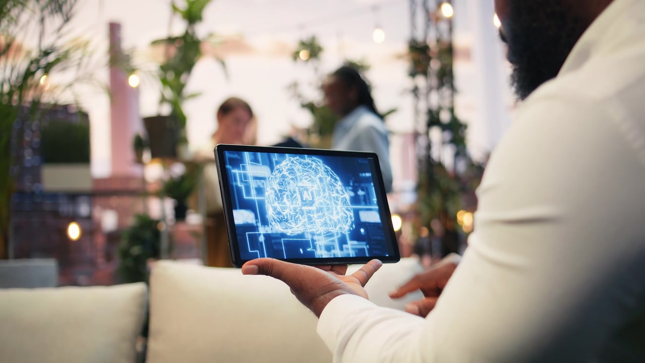 Close up of tablet displaying AI brain during rooftop business presentation