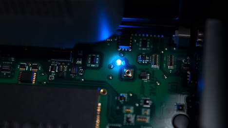 Close-up of a Circuit Board with a Glowing Blue LED