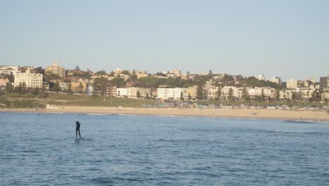 Man-on-Paddleboard-North-Bondi-Beach-in-New-South-Wales,-Australia