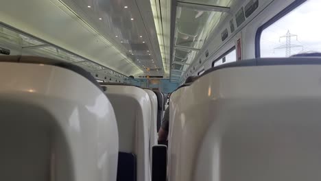 passenger's view inside intercity irish train heading to dublin in ireland