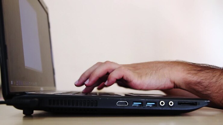 Young Man Using Laptop 2