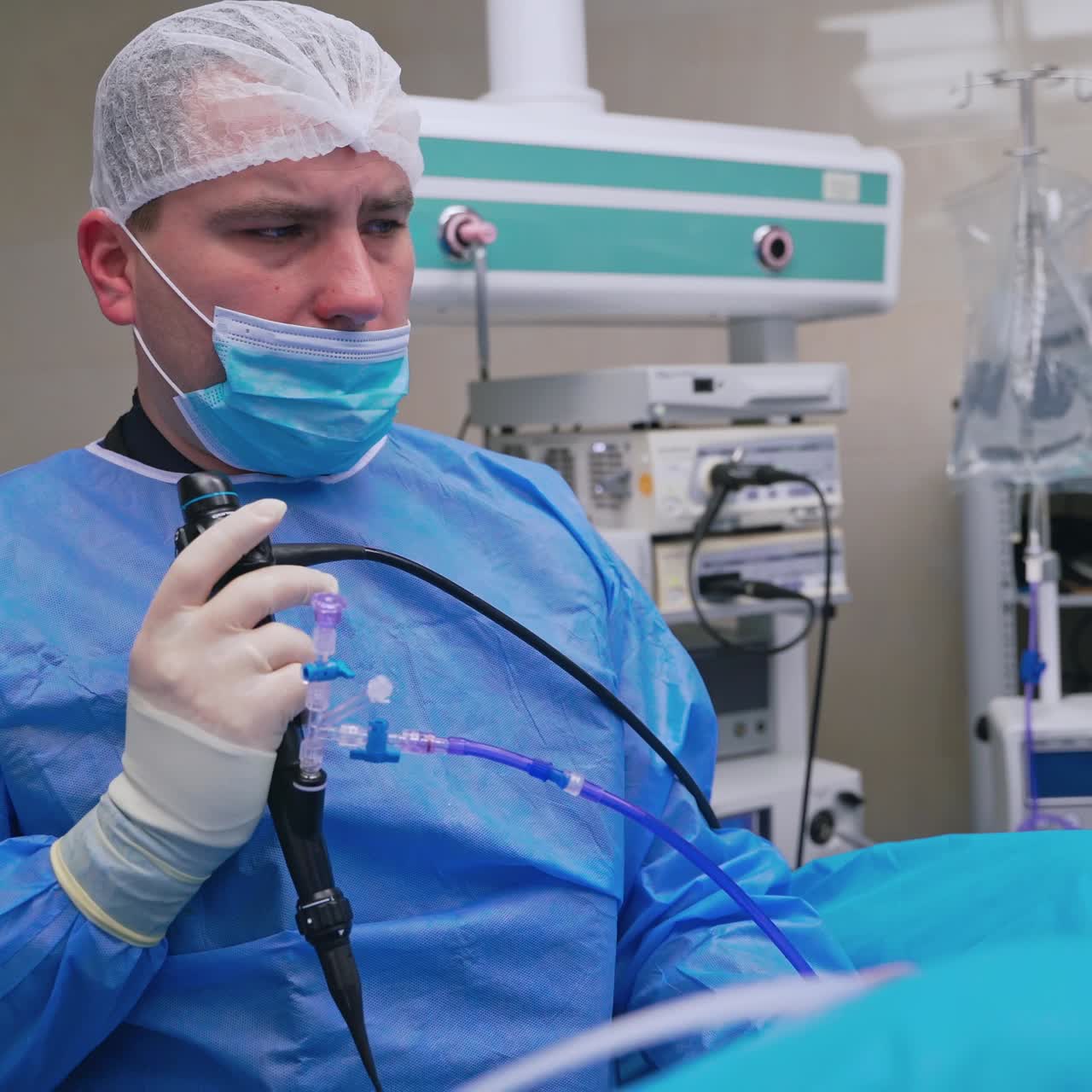 Doctor performing an endoscopic procedure in an operating room