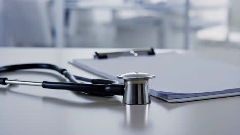 Stethoscope and Clipboard on a Doctor's Desk