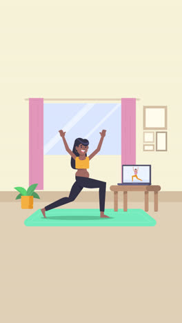 woman practicing yoga at home with online tutorial