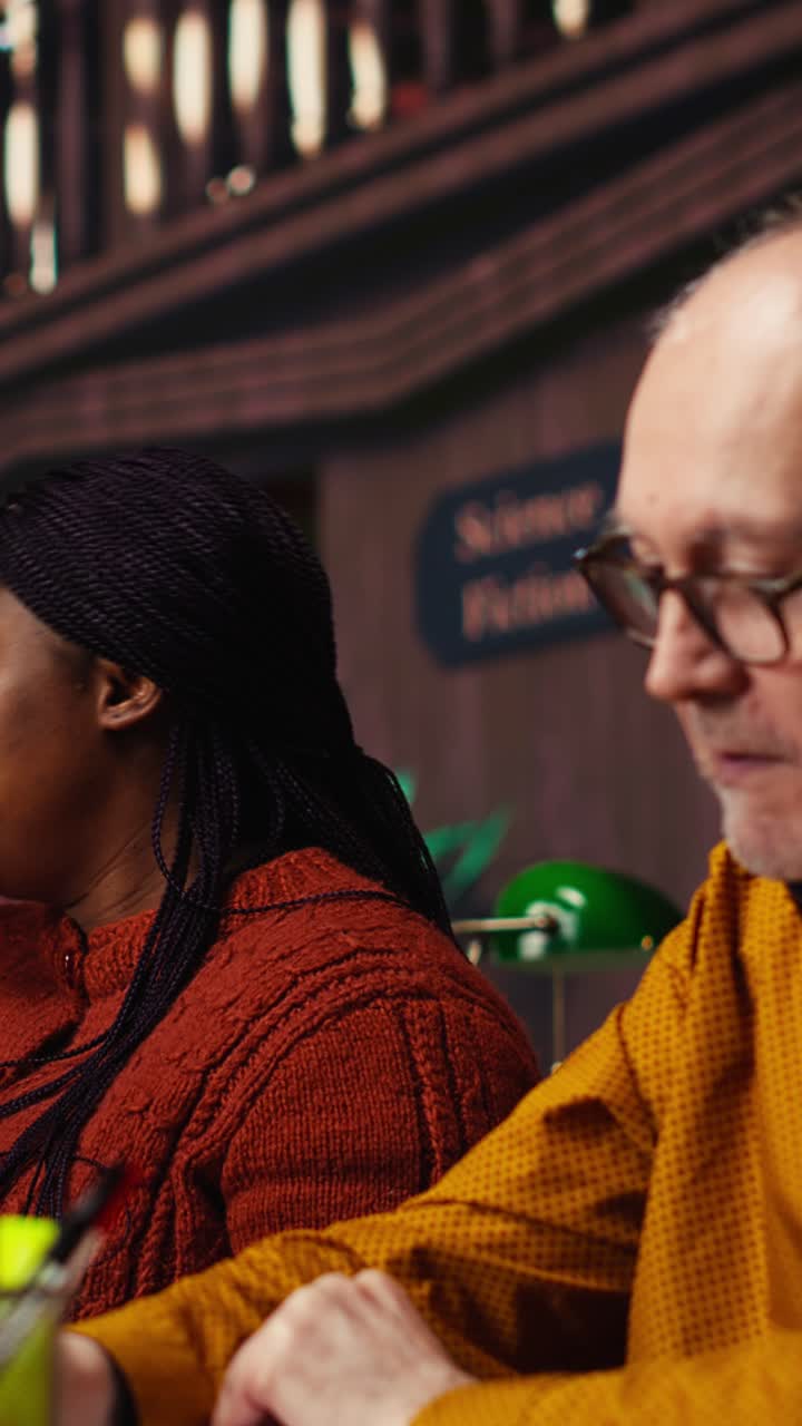Vertical Video Diverse actors practicing theatre script with deep dedication in a library