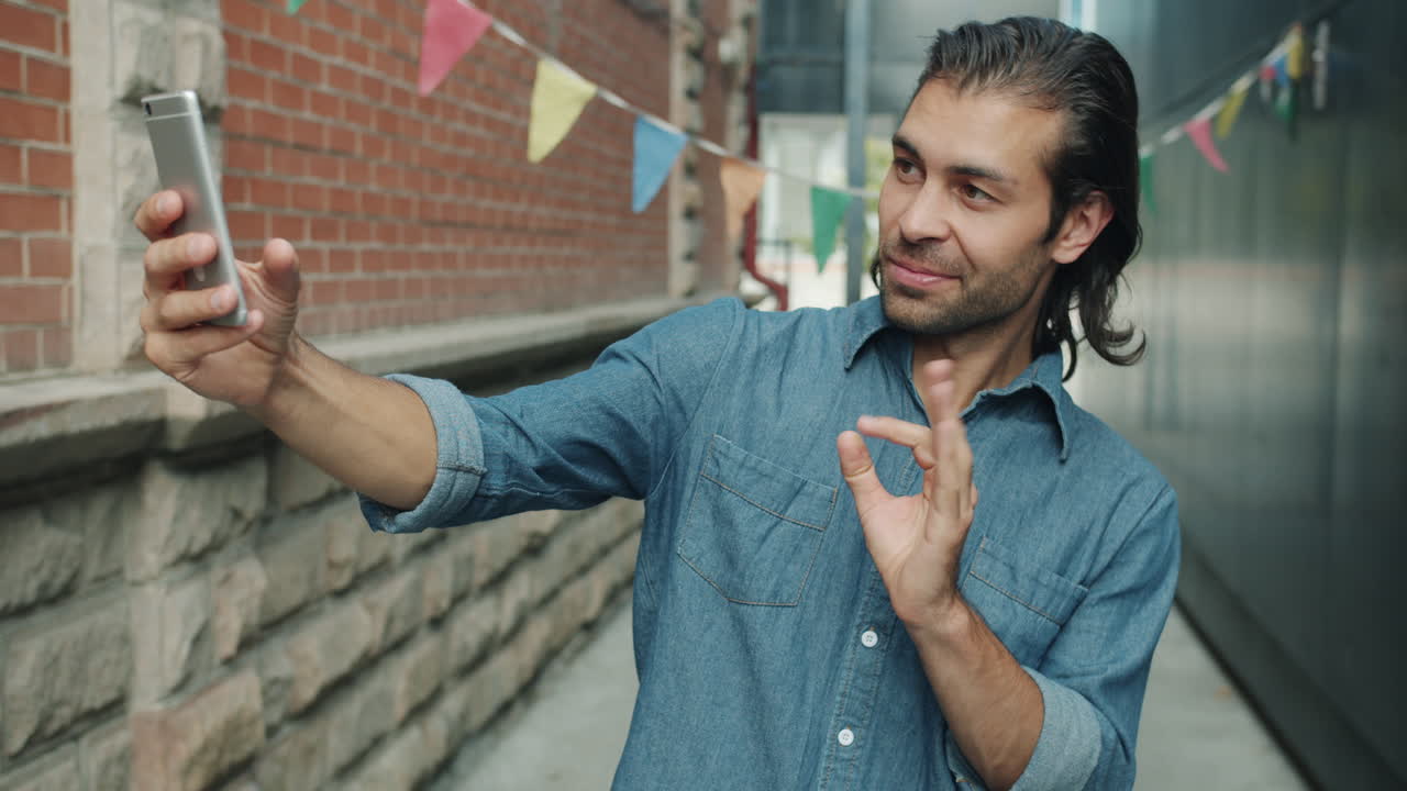 Man Taking Selfie in Urban Alleyway