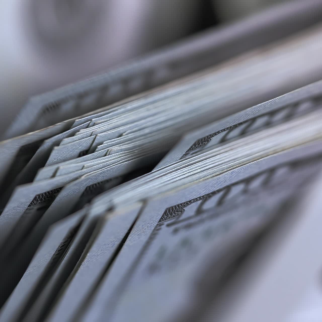 Money counting equipment for paper money calculation. US national paper currency. Automatic mechanism for bank financial operations