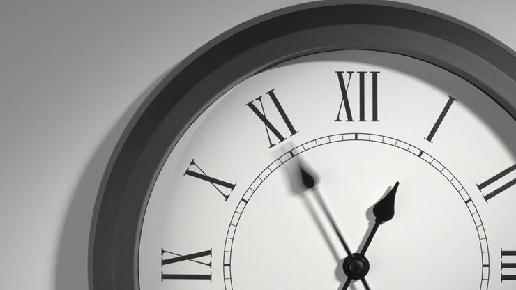 Latin Clock Face in Time Lapse on White Wall