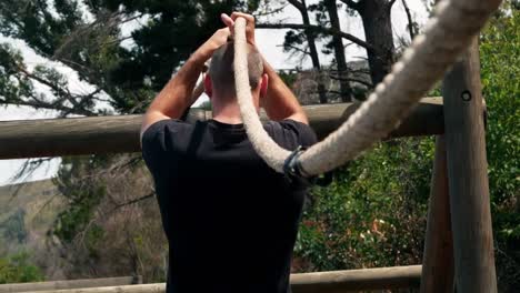 military man performing rope exercise