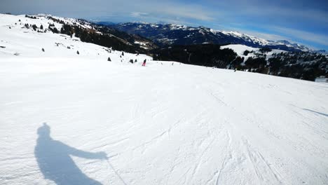 skiing down a mountain with a action camera on the helmet