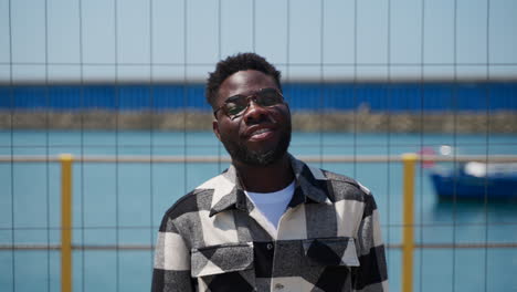 man portrait by the water