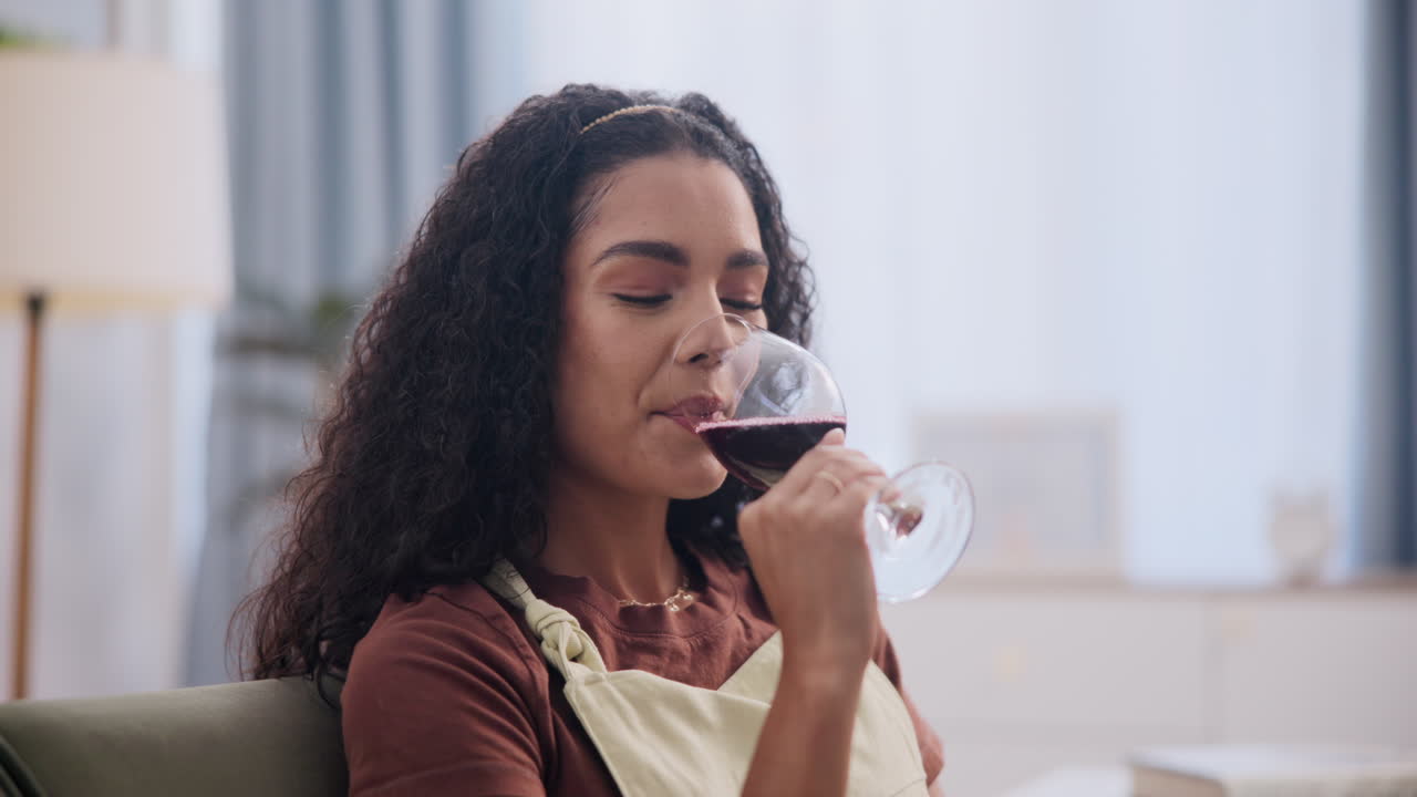Woman Enjoying a Glass of Red Wine at Home