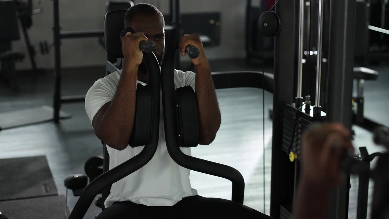 African American Man Doing Chest Press Exercise in a Gym