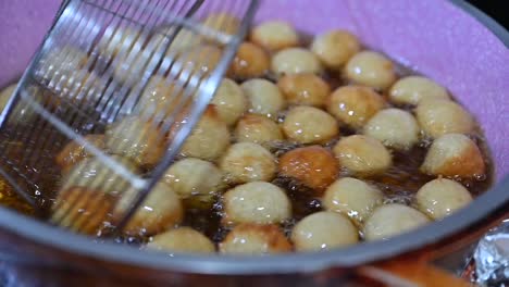 luqaimat balls, the most popular emirati desserts, are being prepared