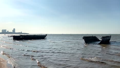 abandoned boats on a serene pattaya beach