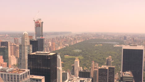 zoom out, view of central park and buildings and skyscrapers in manhattan, new york city