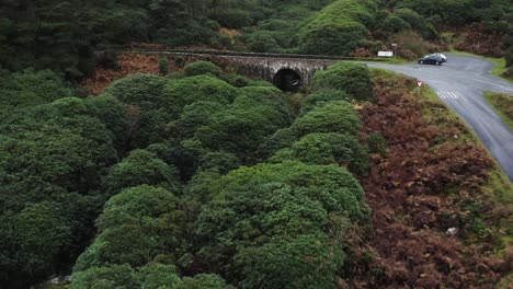 Aerial-view-of-an-empty-ancient-bridge-in-the-Knockmealdown-mountains-of-Clogheen,-Tipperary,-Ireland