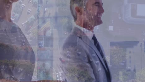 Animation-of-businessman-handshake-over-cityscape