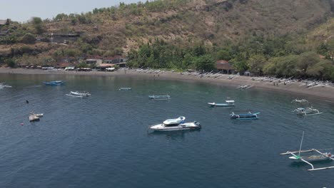 aerial view of secluded tourism beach in mountainous bali, indonesia