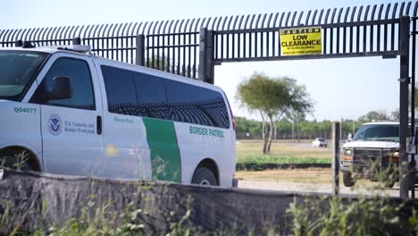 border patrol agents driving out from el paso border wall