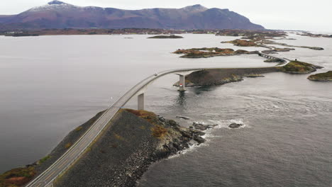 Car-Driving-Down-On-Storseisundet-Bridge-At-Atlanterhavsveien-In-Norway