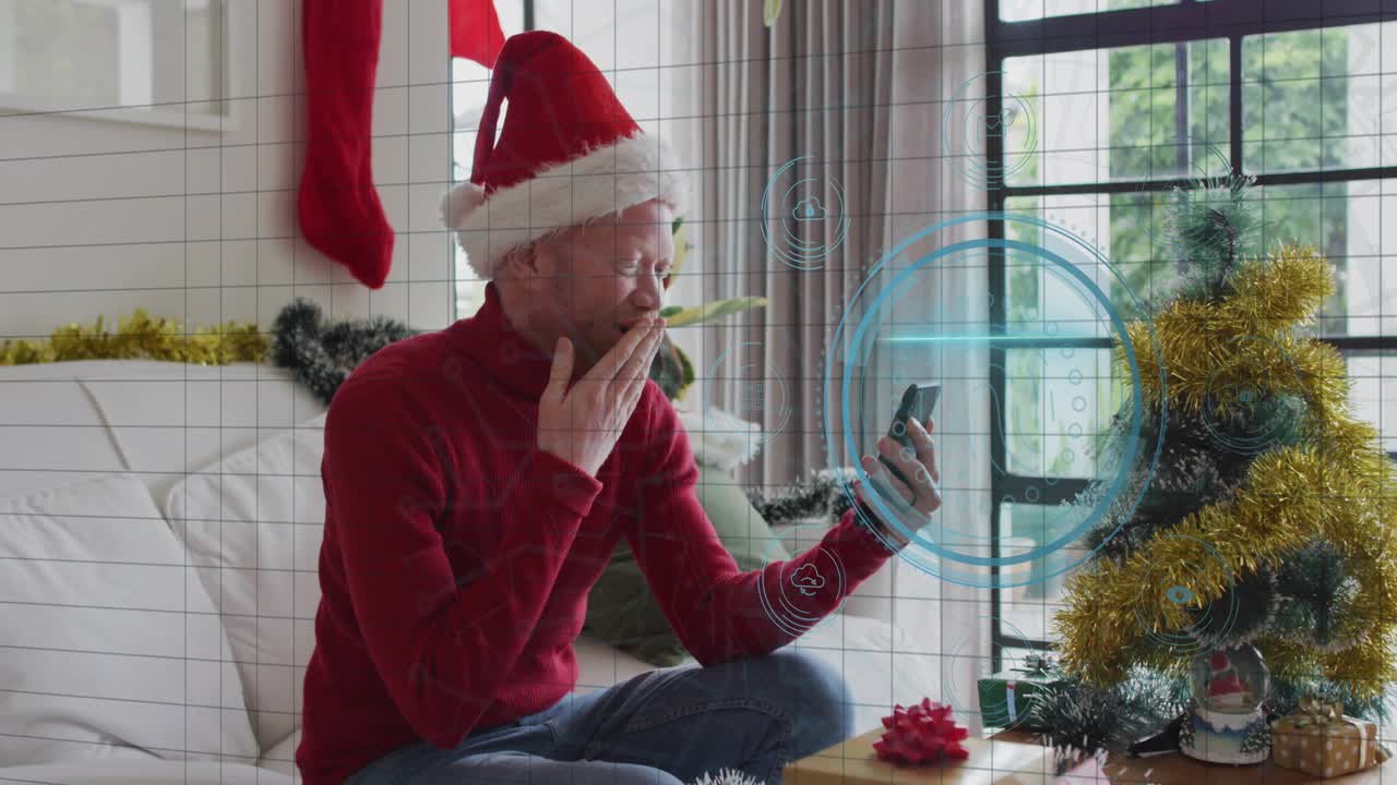 Man in Santa hat holding smartphone, incoming call initiating HUD protecting data while greeting