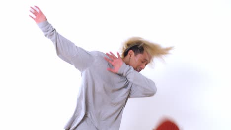 happy asian man dancing on a white background, video in 4k 50fps