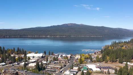 wide aerial pulling away from the town of mccall in idaho