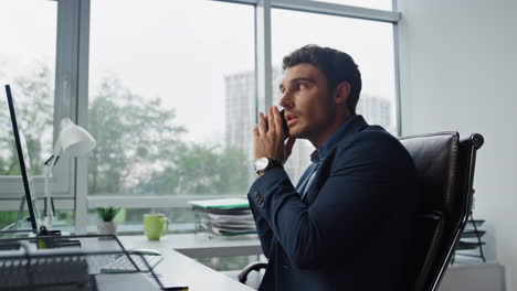 Focused-businessman-talking-phone-in-office-closeup.-Manager-assistant-helping