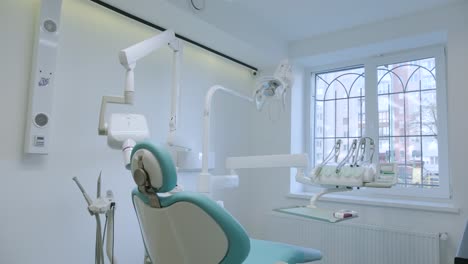 modern dental practice. dental chair and other accessories used by dentists in blue, medic light.