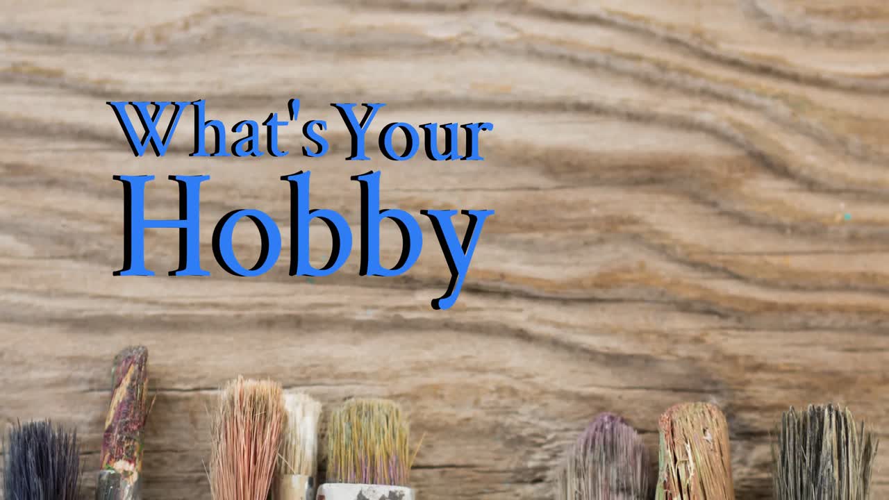 Animation of what's your hobby text over paintbrushes wooden table top