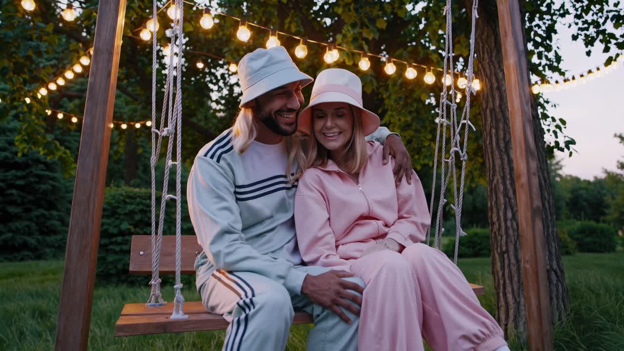 Couple enjoying a swing in the park