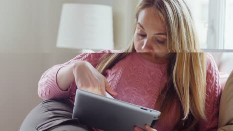 Woman-using-mobile-phone-and-digital-tablet-4k