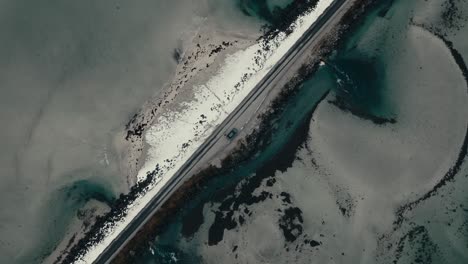 above view of road bridge in lofoten islands, norway. aerial topdown shot