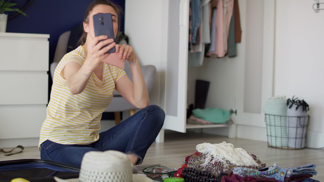 Video of woman taking a selfie during preparing to travel