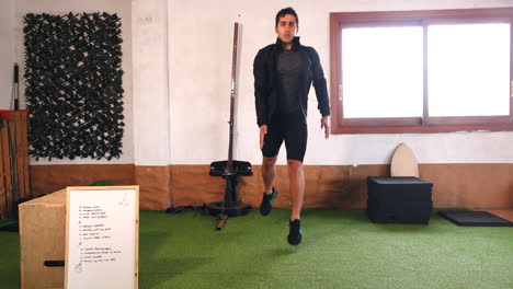 trainer during online training routine performing stride jumps