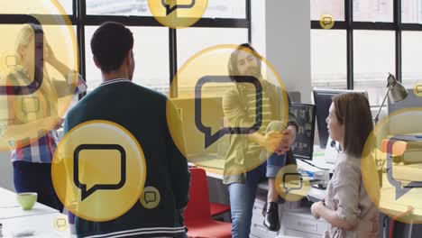 animation of media icons over diverse business people during meeting