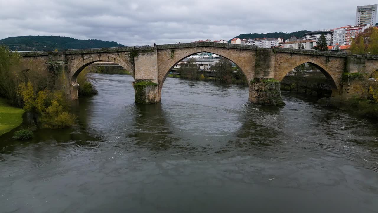 Quick reverse dolly from Ourense Roman Bridge on Mi&ntilde;o River in Ourense, Galicia, Spain