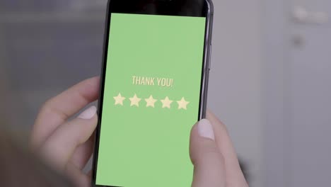 woman rating 5 stars using her phone