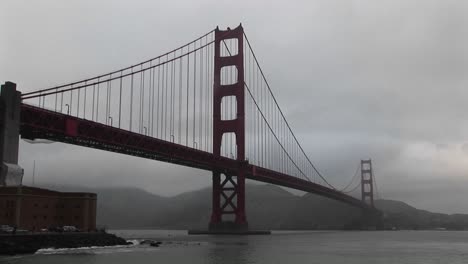 view of the golden gate bridge's incredible span across san francisco bay on a foggy day