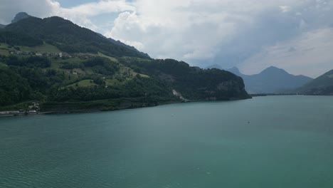 Walensee-lake-crowned-with-lush-green-Swiss-Alps-in-Switzerland,aerial