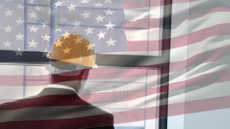 animation of american flag waving over portrait of happy african american architect