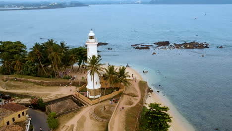 Aerial-drone-of-Galle-fort-Lighthouse-at-sunset-golden-hour