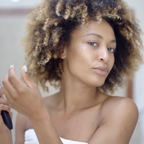 Woman-Fixing-Hair-In-The-Morning