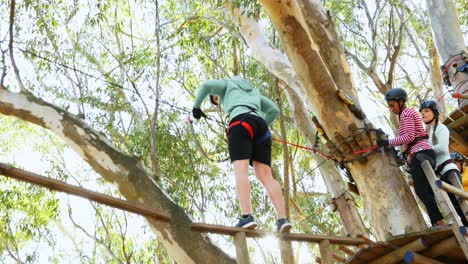 friends crossing zip line in the forest 4k 4k