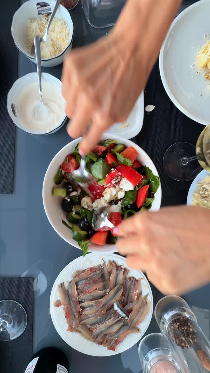 Preparing a Greek Salad with Anchovies