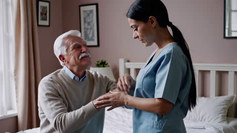 caregiver providing assistance to an elderly man