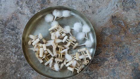 candle-floating-wick-made-of-wood-and-cotton-at-plate