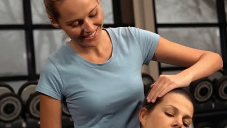 fitness trainer giving a massage