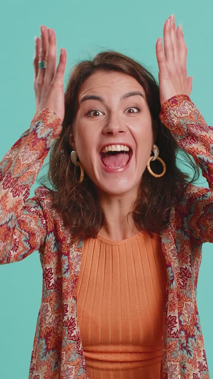 Excited amazed woman surprise looking at camera with big eyes shocked by sudden victory wow emotion